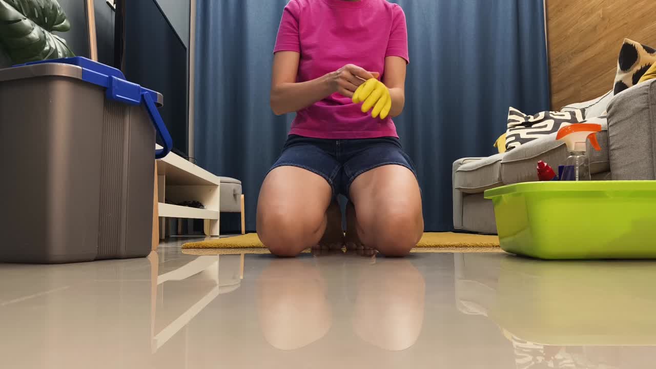 Woman cleaning floor indoors
