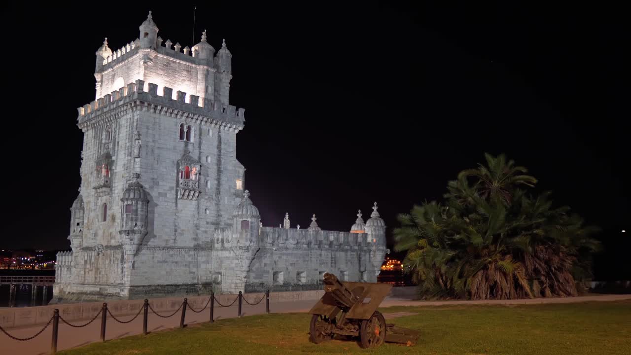 Unesco World Heritage Bel&eacute;m Tower at night with medieval canon in the foreground in Lisbon, Portugal