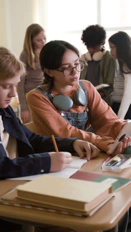 students collaborating and learning in a classroom