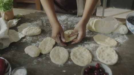 hands kneading dough for homemade baking