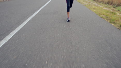 woman-running-on-road-close-up-shoes-steadicam-shot