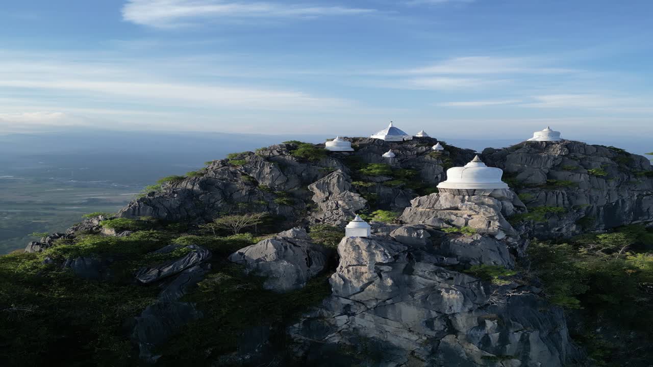 This is a temple in Thailand called "Wat Chaloem Phra Kiat Phrachomklao Rachanusorn" on a beautiful afternoon.