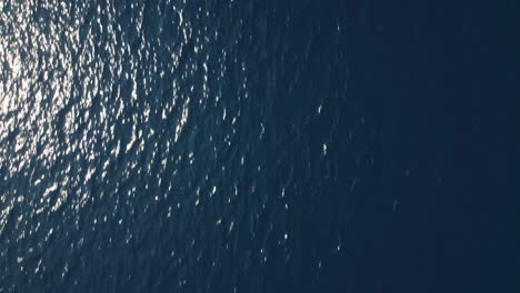 Loopable-flyover-of-glistening-clear-blue-water