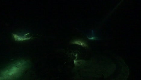 airplane wreckage underwater at night