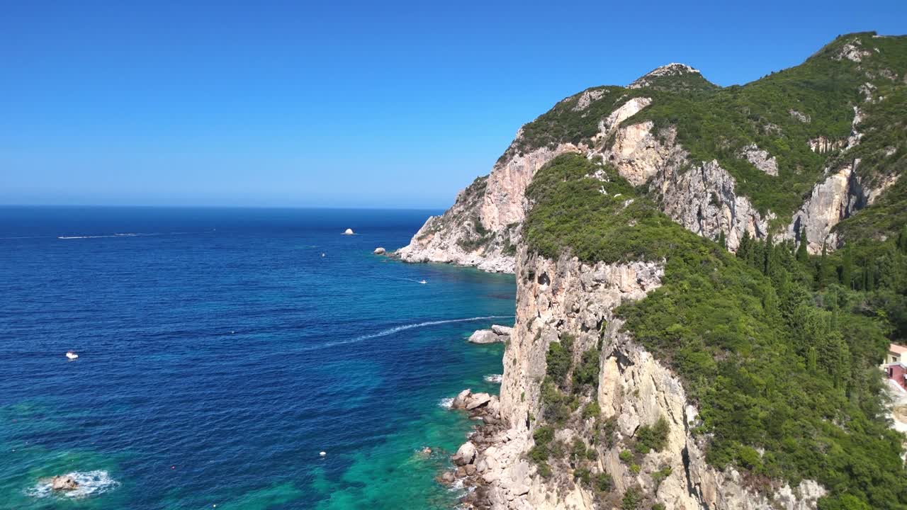 Scenic cliffside view of azure waters and lush greenery, sunny day