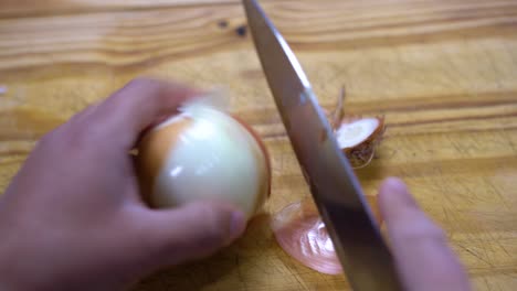 slicing onion chopping into julienne on wooden board kitchen healthy healthy diet