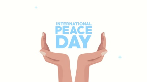 international peace day lettering with hands protecting