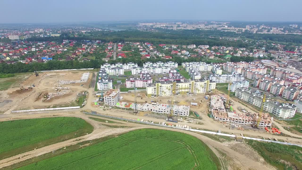 construction of a modern district with high-rise buildings for people. Camera motion around. Landscape of city in aerial view