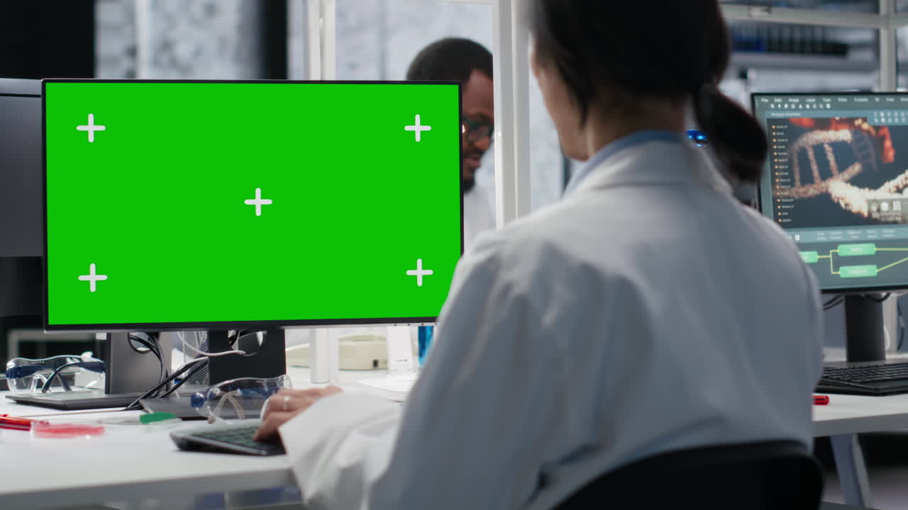 Senior Researcher Working On Isolated Screen Pc In Lab, Studying Genomics