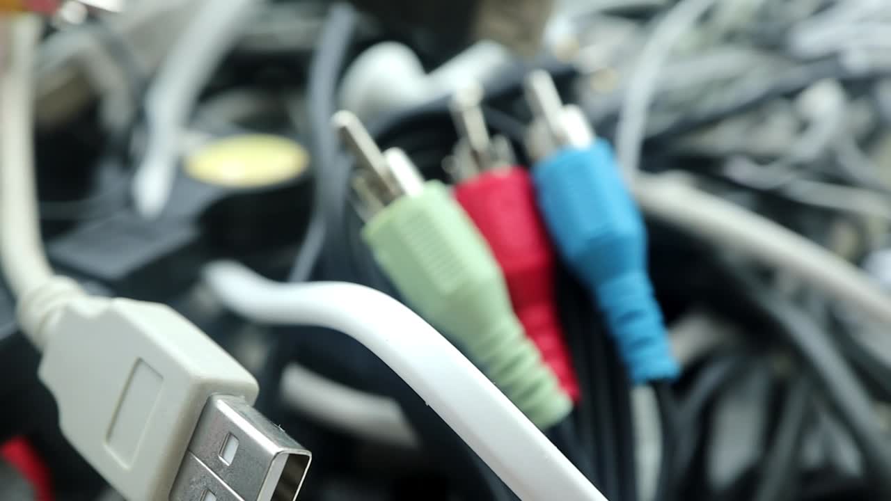 Electronic components, audio-video cables, RCA plugs and USB connectors.