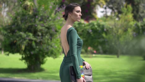 beautiful model posing wearing green dress outdoor