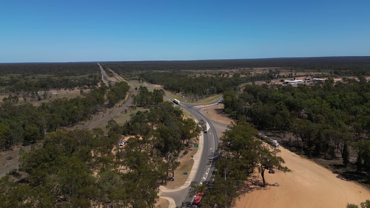 Westerly aerial views over Miles Queensland above a truck stop.