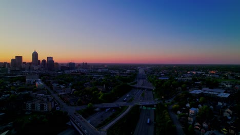 awakening of indianapolis under the soft glow of the golden hour. stunning skyline, intricate highway arteries.