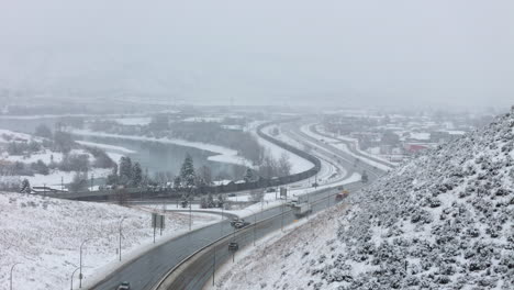 winter in kamloops , semi trucks and cars on the trans canada highway 1