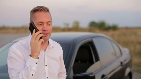 businessman with the problem of checking the car under the hood businessman with the problem of checking the car under the hood car crash