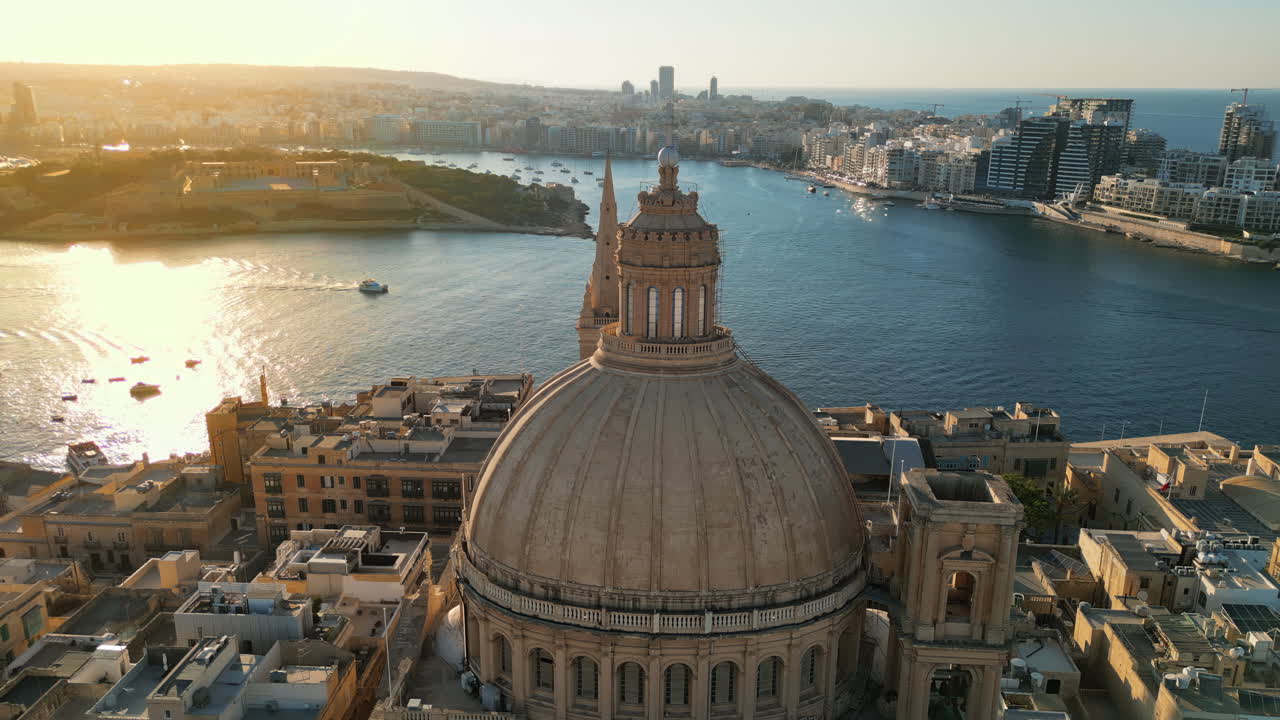 Aerial drone view of the walled city of Valletta, Malta, surrounded by the Mediterranean sea in daylight