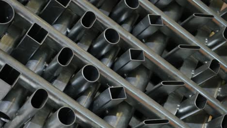 metal pipes used in the industry of various sizes and thicknesses are rotated and displayed.