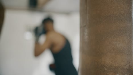 blurry man boxing in gym