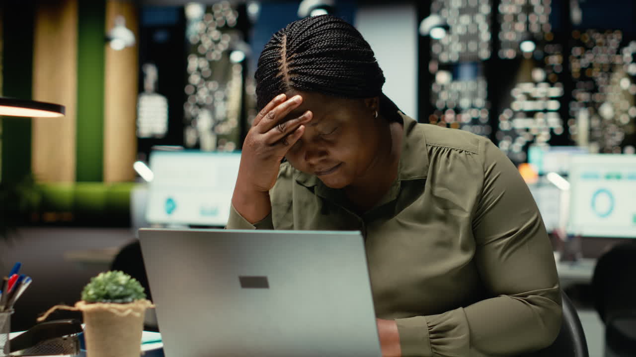 African american woman after hours feeling unstable and overwhelmed