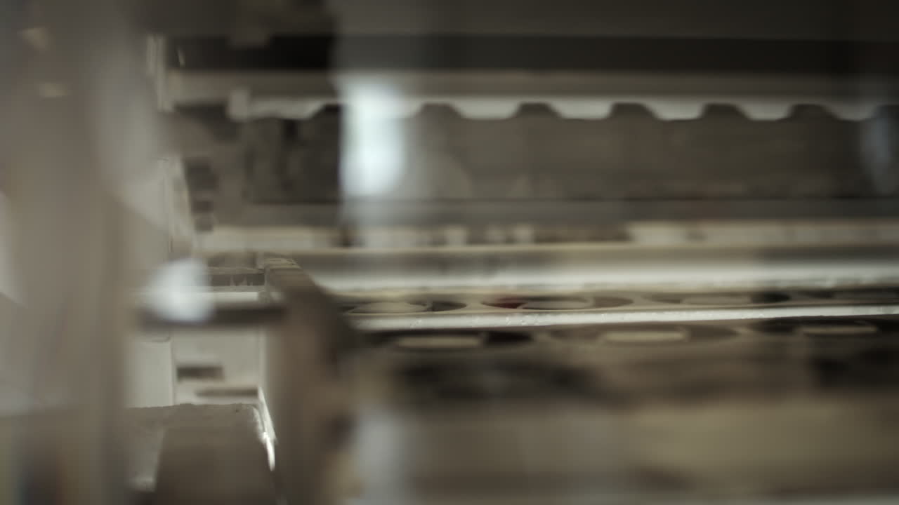 Inside of a printing machine, parts moving on the produsction line
