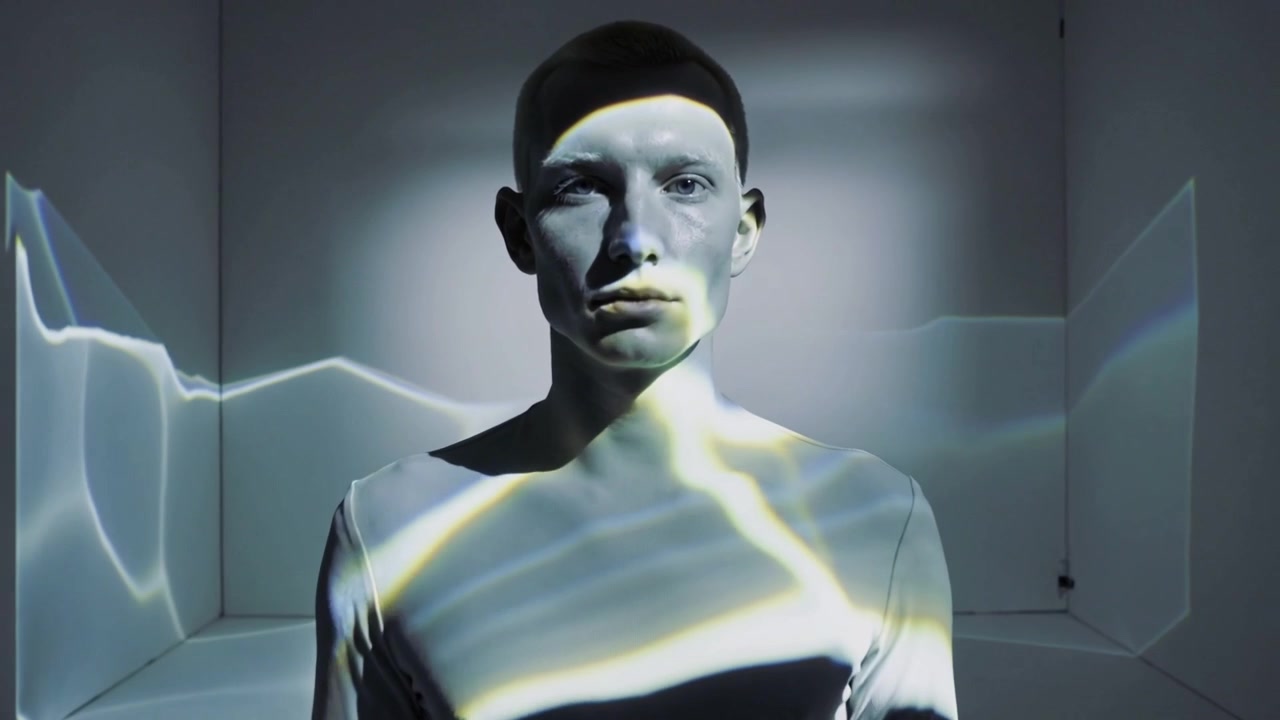 Projector starting, man holding pose in white cube room, receiving waves on gray top for mapping