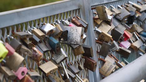 many locks hanging on a fence. love promises