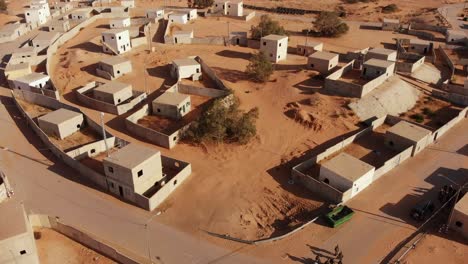 aerial-shot-revealing-soldiers-walks-at-palestine-near-gaza-in-the-desert-at-an-empty-city