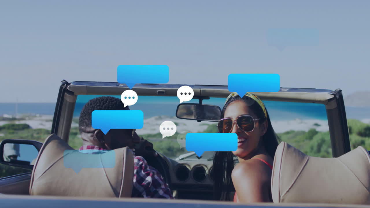 Driving convertible by ocean, couple with animation chat bubbles floating around