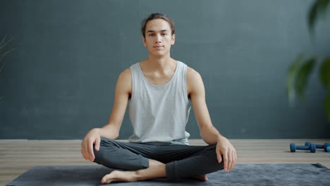 man meditating in yoga pose
