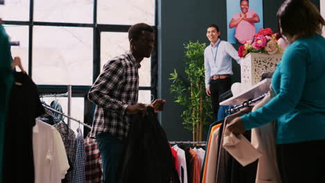 cheerful couple playing with clothes