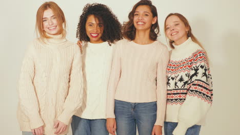 four women in cozy sweaters