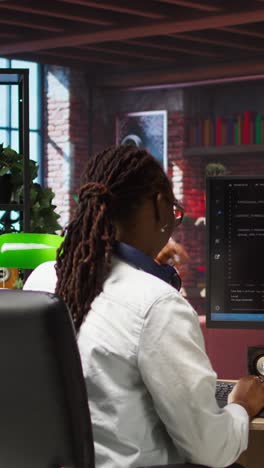 vertical video woman works with ai deep neural networks on pc at home