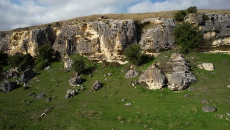 Limestone-cliff-formation-in-New-Zealand,-drone-slider