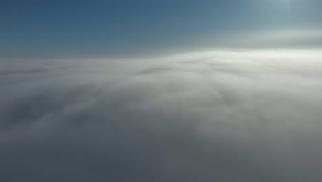 time lapse from above the clouds in sunrise with drone 01