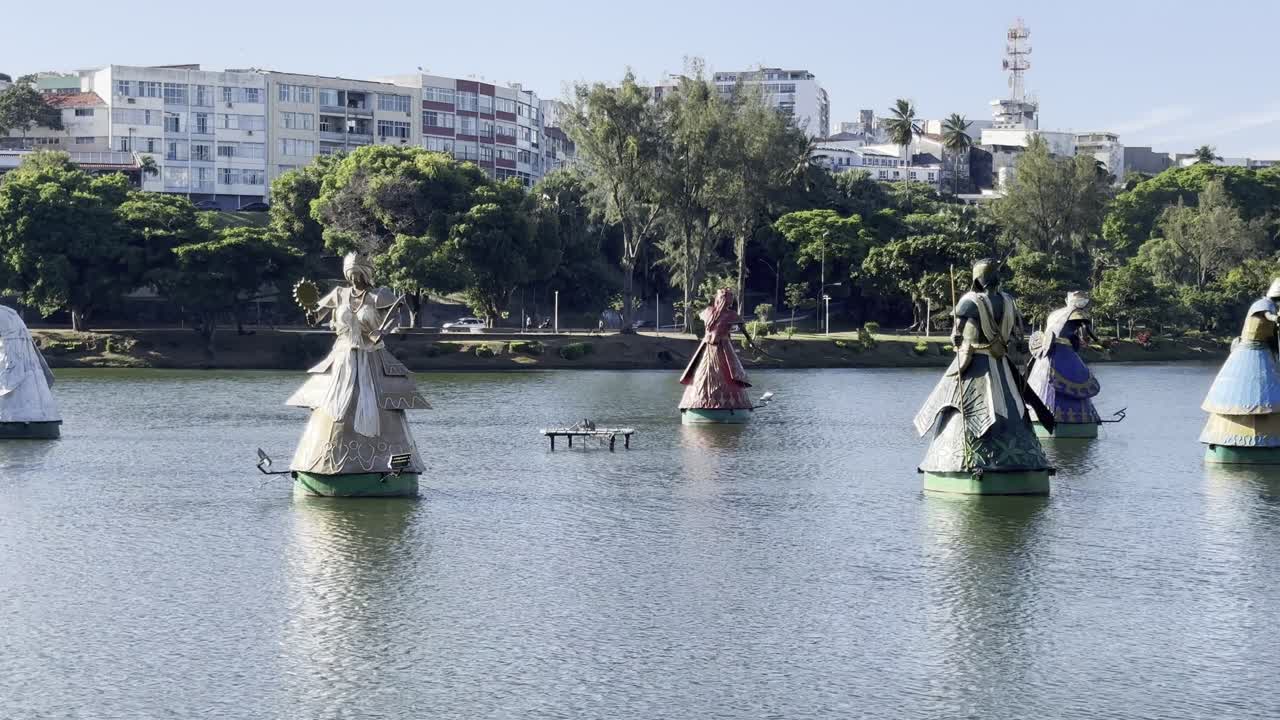 Sacred Orisha statues in a lake in Salvador de Bahia, Brazil, celebrating Afro-Brazilian culture, Candomblé, and the spiritual energy of the Orixás, especially Yemanjá during celebrations.