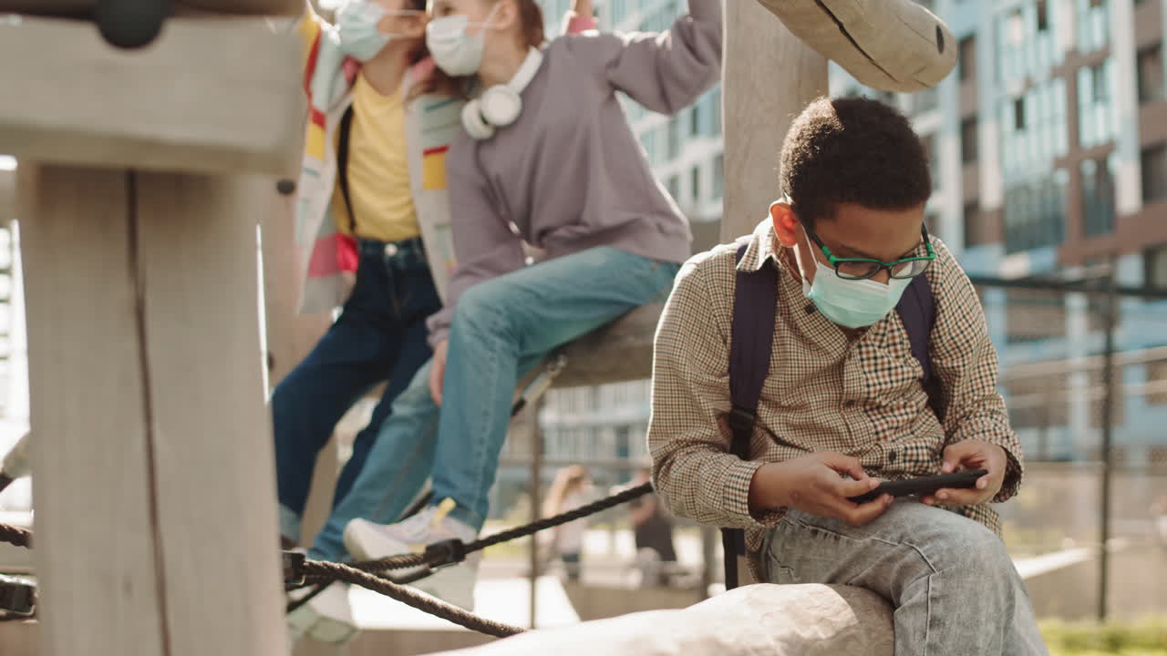 Afro American Schoolboy in Face Mask at Playground