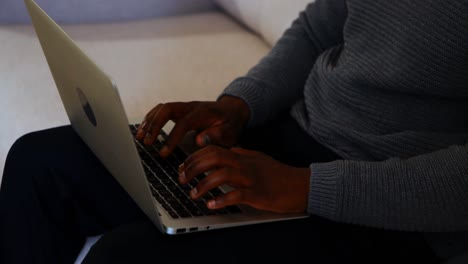 male executive using laptop in office