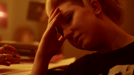 close-up of a woman receiving care or consultation in a dimly lit room.