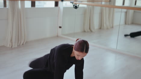 young girl performing contemporary dance in studio