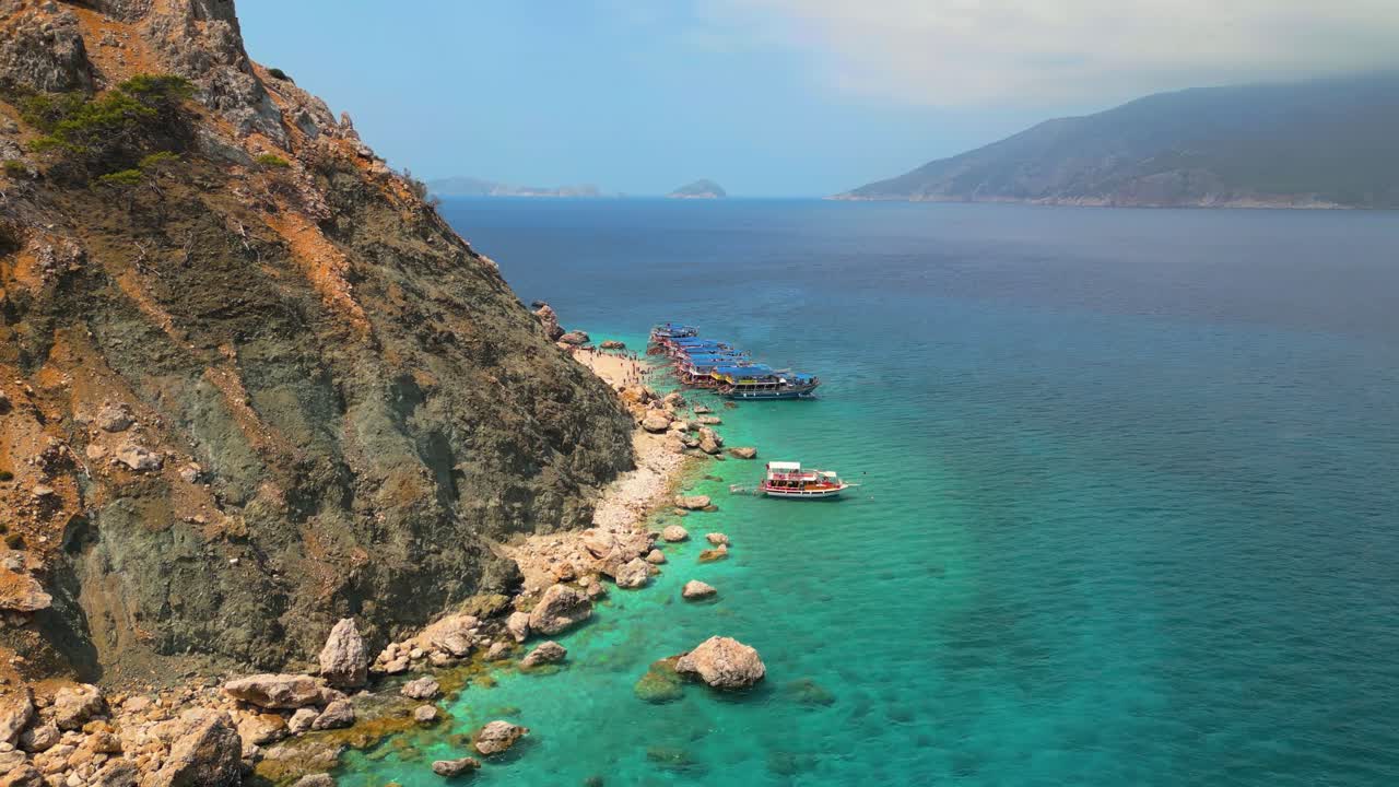 Stunning aerial footage captured by drone showcasing the crystal-clear turquoise waters and white sand beaches of Suluada Island - 4K Cinematic Drone Footage - Suluada - Turkey_13