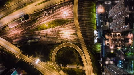 aerial hyperlapse above illuminated kowloon fast traffic city life hong kong at night