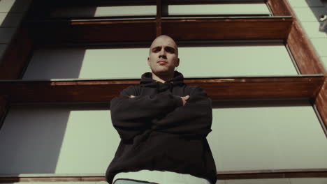 stylish man in front of a modern building