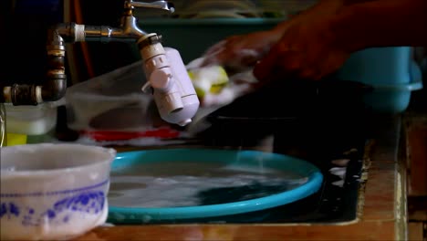 washing dishes in a kitchen sink
