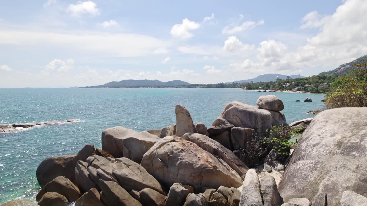Beautiful 4K drone footage of the beach and unique rock features at Hin Ta Hin Yai Beach on Koh Samui in Thailand