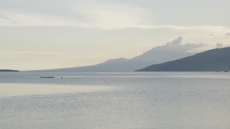 Scenic-seascape-and-mountain-view-in-Cebu,-Philippines-during-cloudy-evening