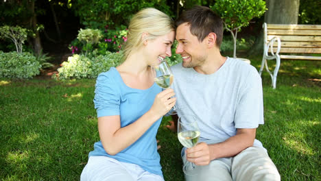 happy couple drinking white wine together