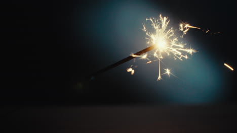 a sparkler burn in the dark room