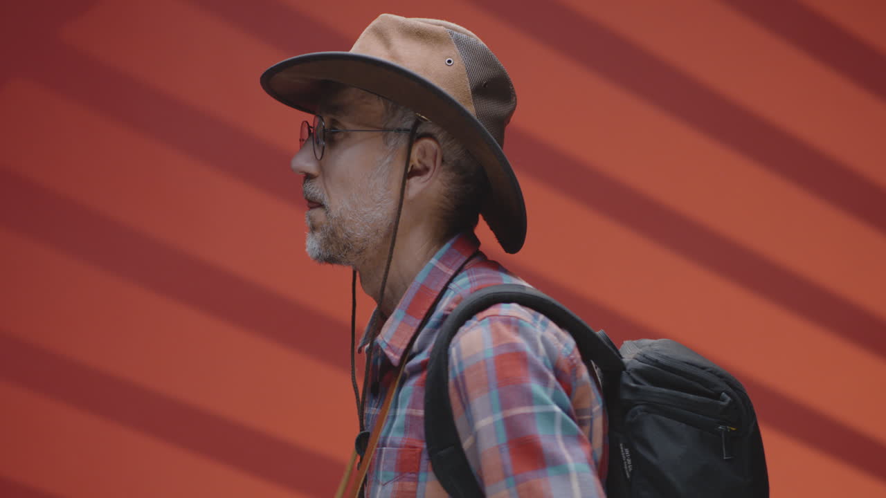Man with Camera and Cowboy Hat