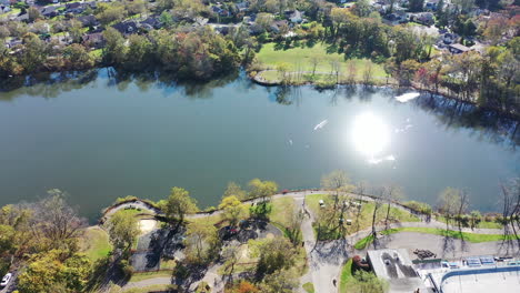 an aerial view of grant pond in a long island, ny suburb