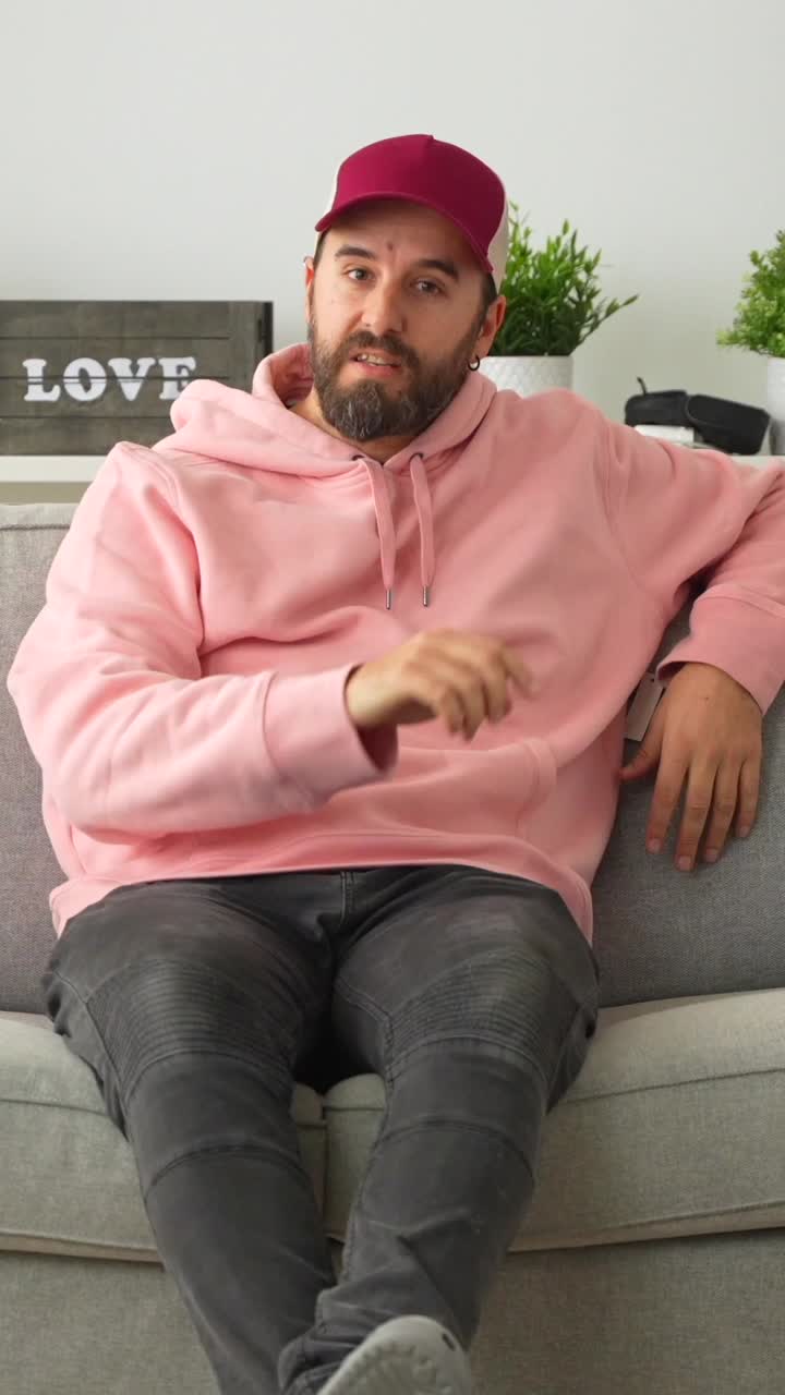 Man sitting on a couch indoors